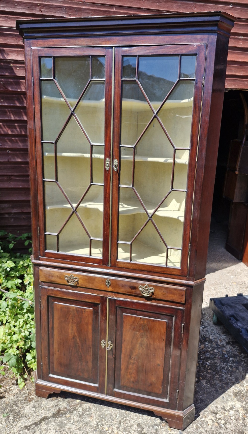 Early 19th century 2 part glazed corner cabinet. 