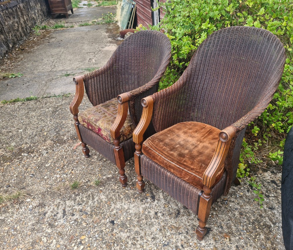 Rare pair of Oak framed Lloyd Loom Ladys and Gents armchairs. View IV