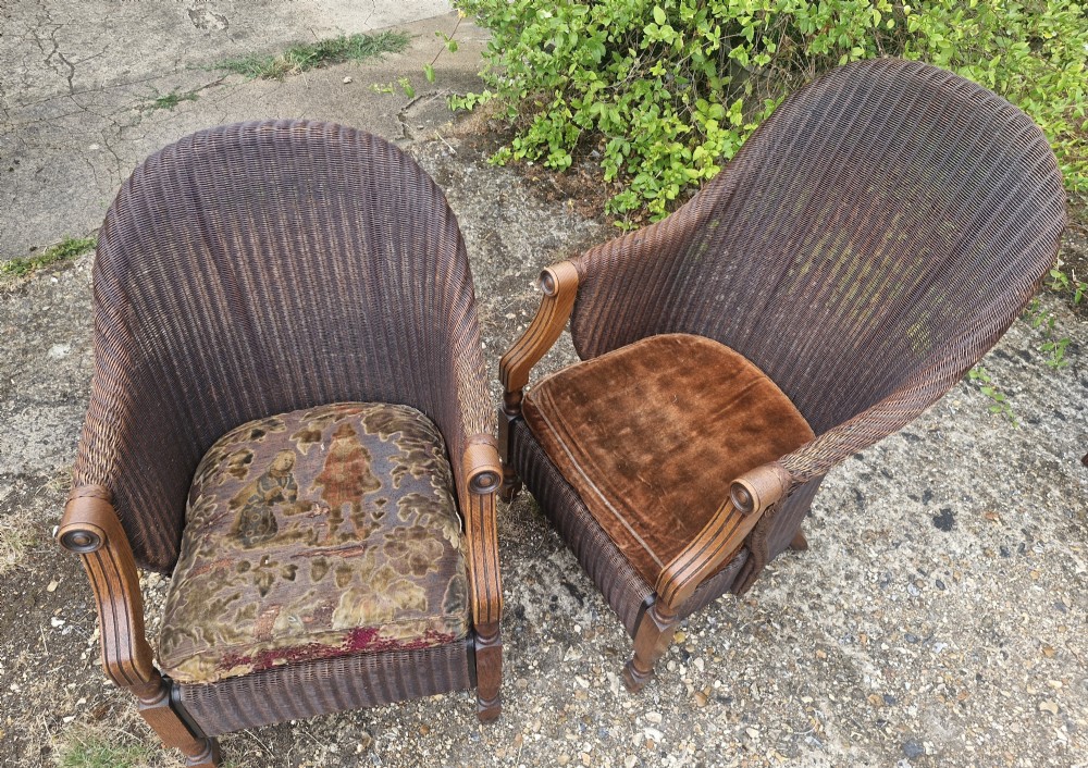 Rare pair of Oak framed Lloyd Loom Ladys and Gents armchairs. View IX