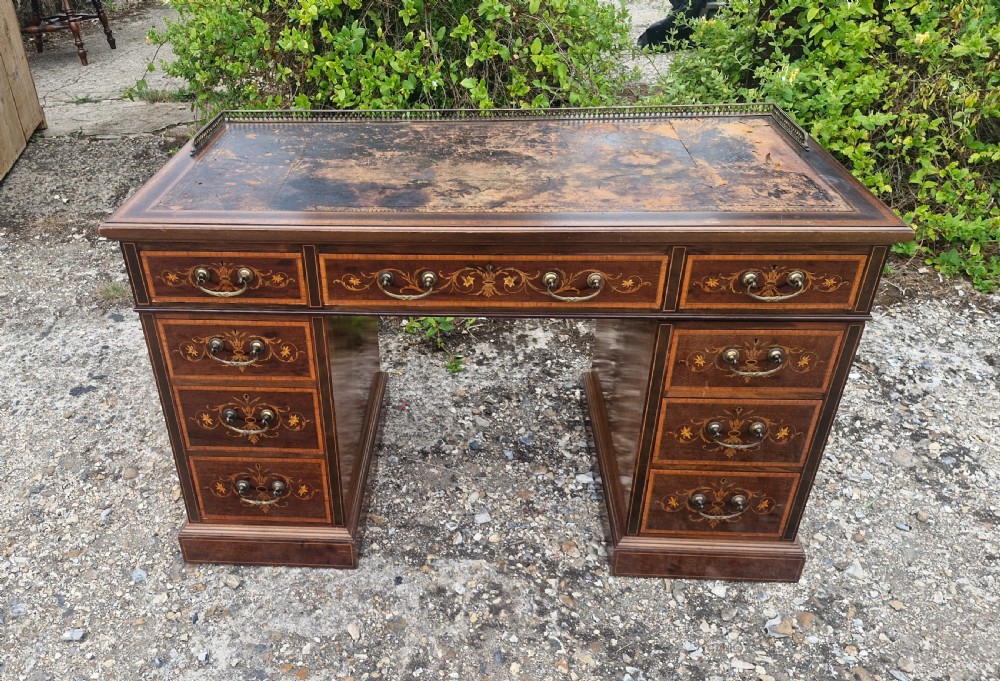 Edwardian inlaid mahogany kneehole pedestal writing desk. 