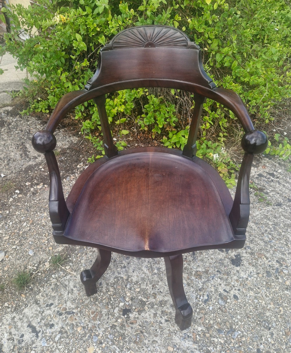 Mahogany revolving desk armchair 