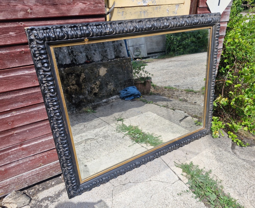 Impressive black and gilt Victorian wall mirror.  View IV