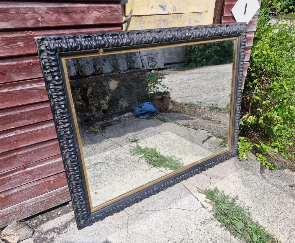 Impressive black and gilt Victorian wall mirror.  View VIII