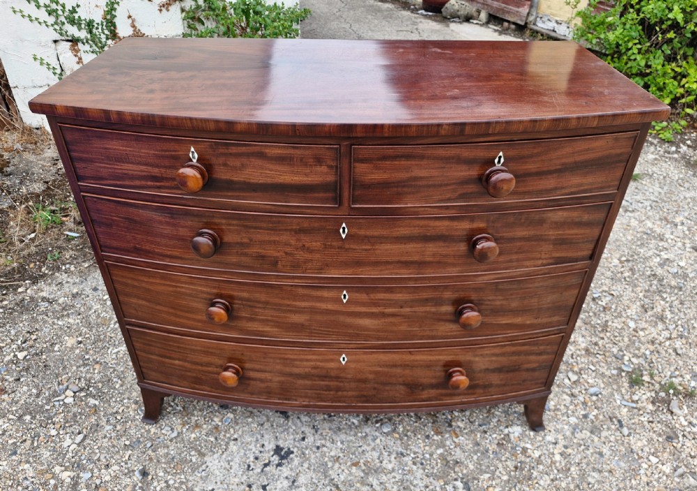 Good quality early 19th century mahogany bow front chest of drawers.  View VI