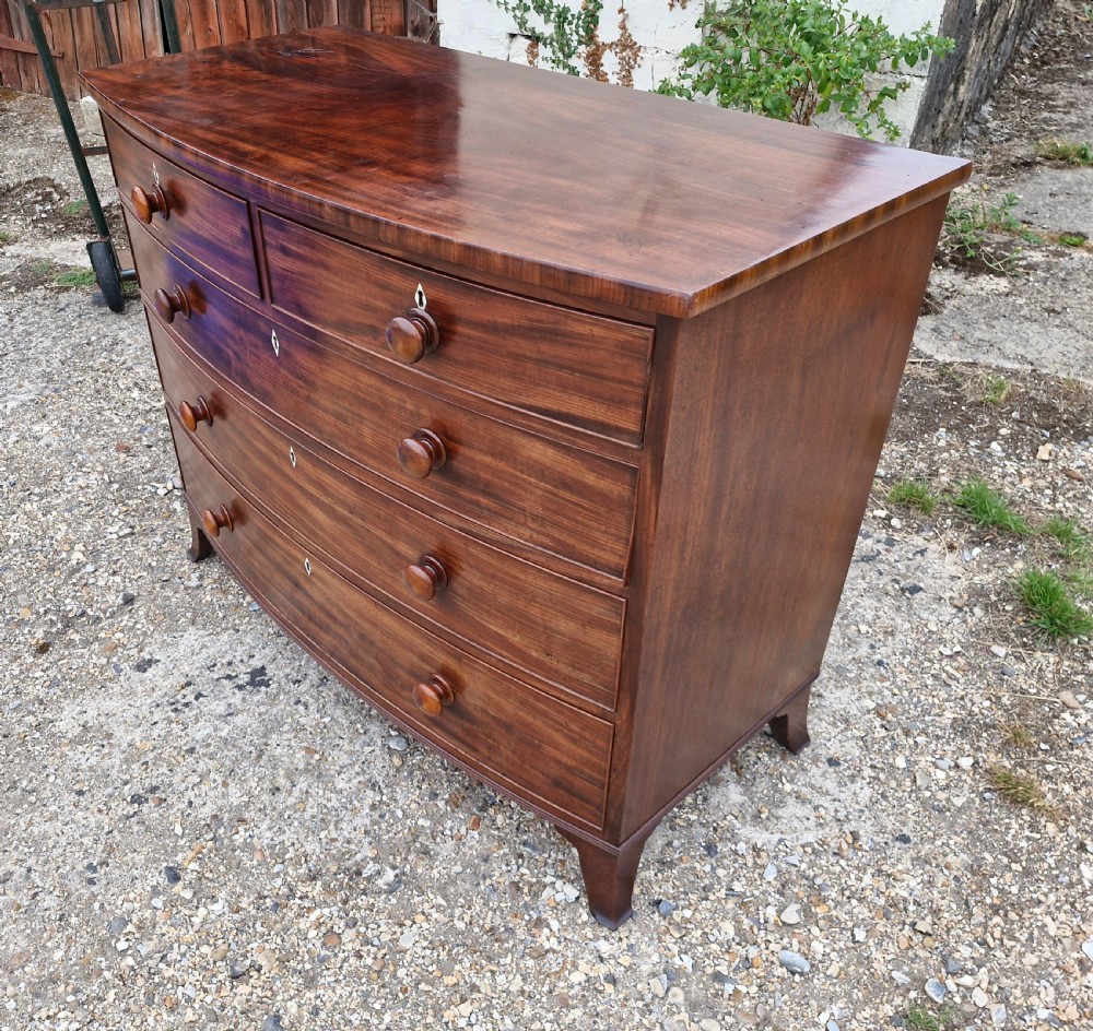 Good quality early 19th century mahogany bow front chest of drawers.  View IX