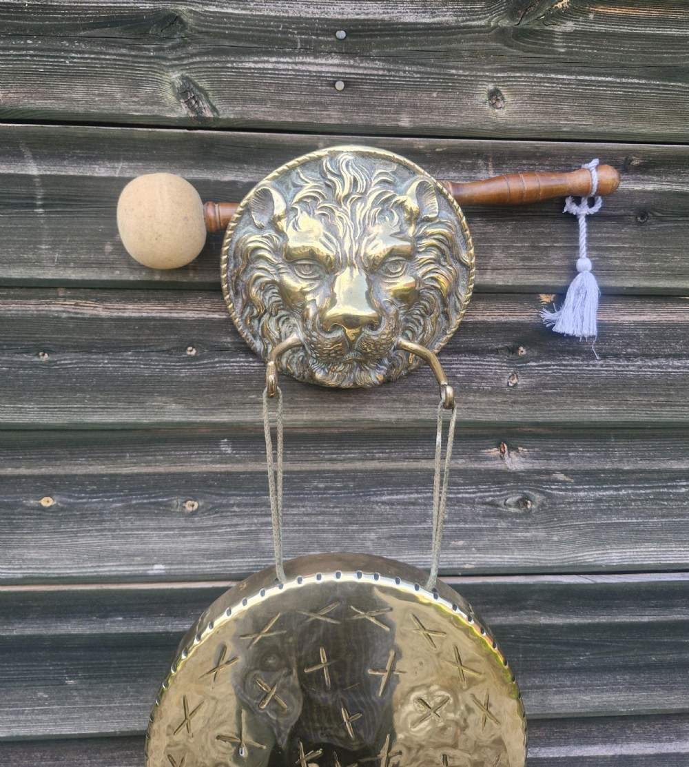 Wall mounted brass dinner gong.  View III