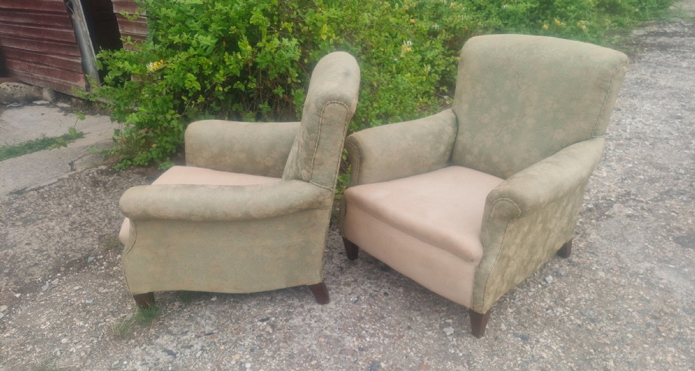 Pair of  upholstered armchairs in the style of Howard. 