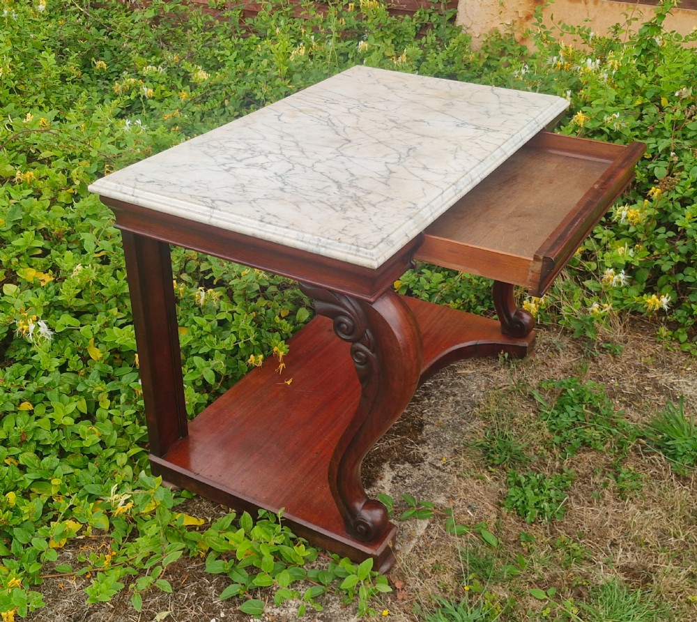Regency mahogany marble top hall table with all round bevel edge. View II
