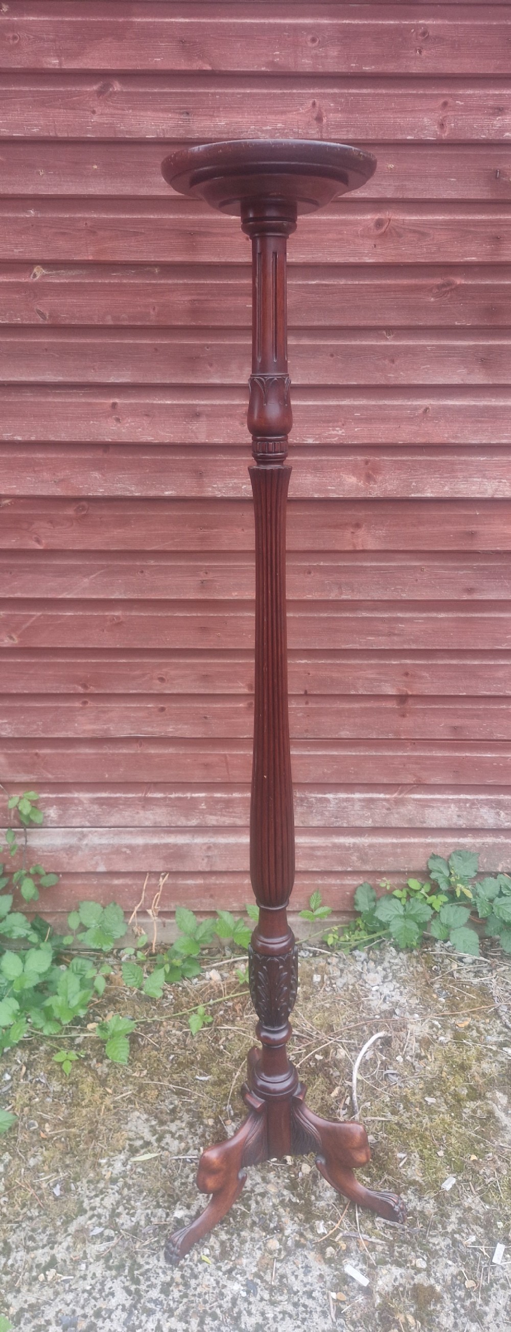 Carved Mahogany torchere plant stand .