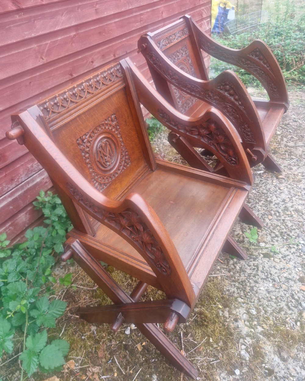 Matched pair of oak Glastonbury armchairs.  View III