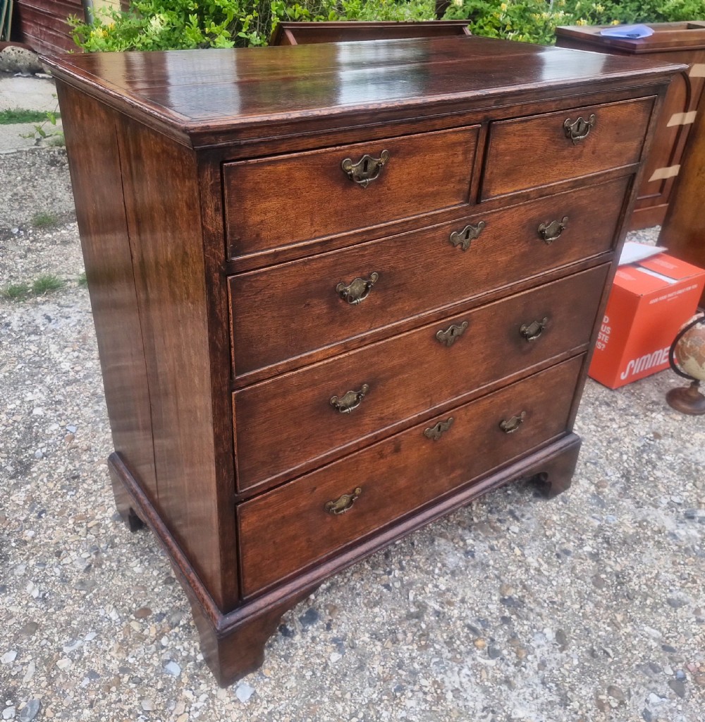 Mid 18th century oak chest of drawers.  View VII