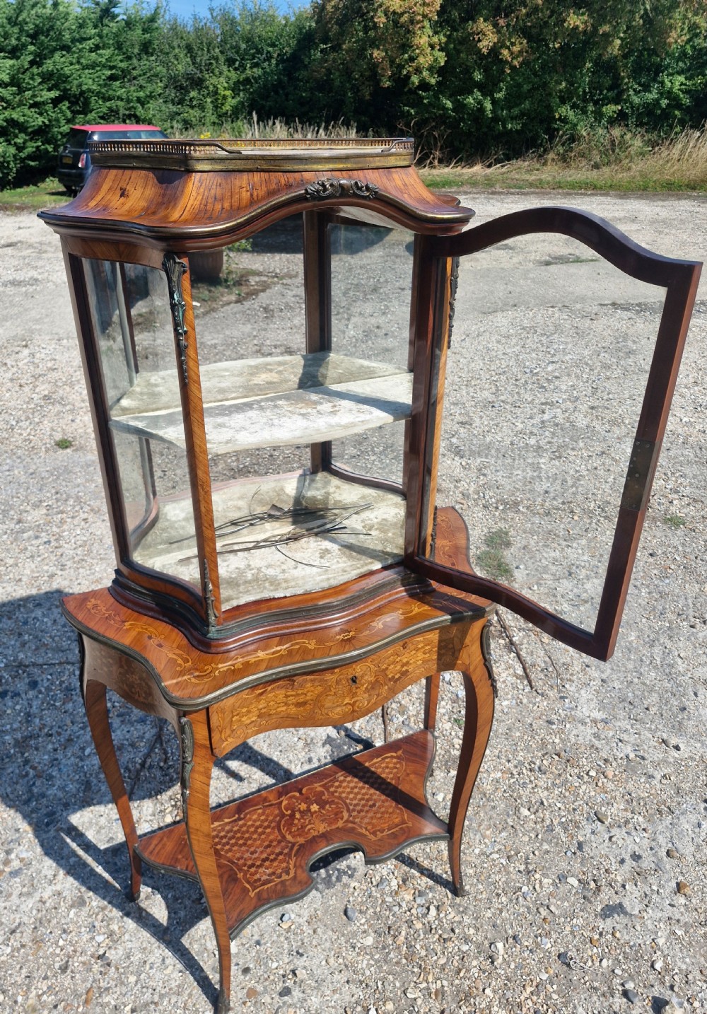 Good quality parquetry and inlaid display cabinet with writing drawer.  View V
