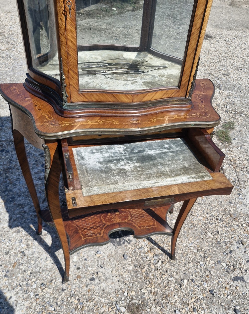 Good quality parquetry and inlaid display cabinet with writing drawer.  View VII