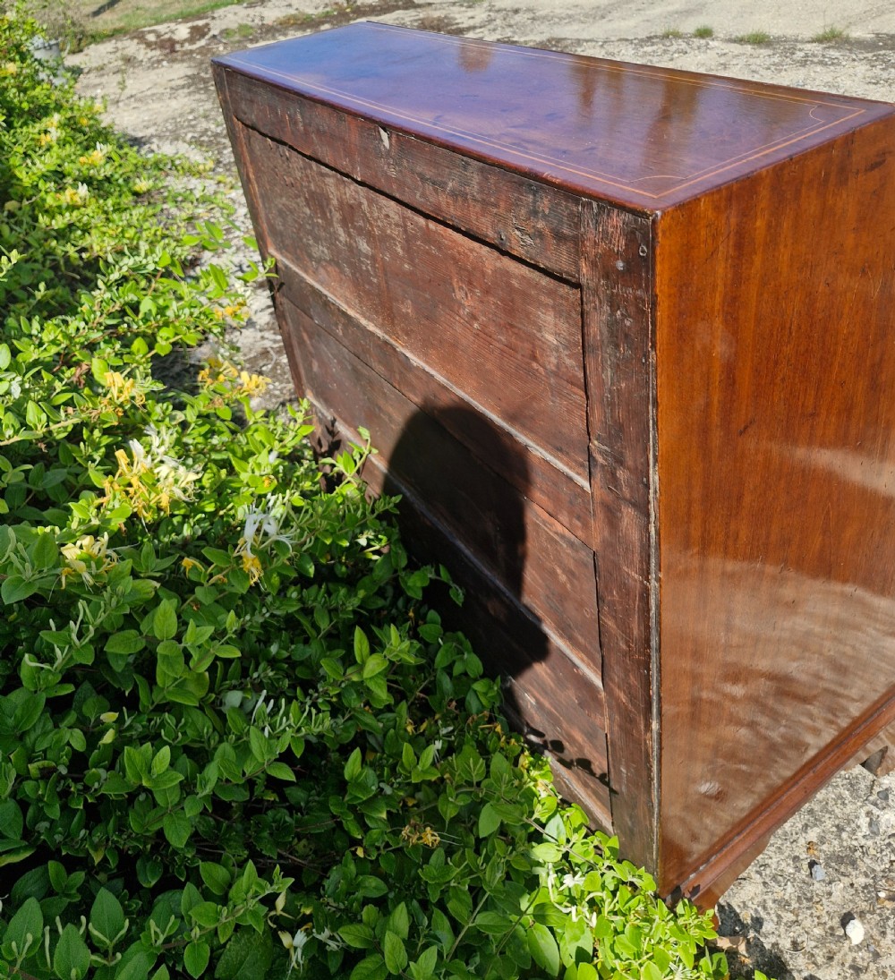 A late Georgian mahogany writing bureau featuring a sloped fall-front lid with boxwood inlay, four long drawers, brass swan-neck handles, and bracket feet. View III