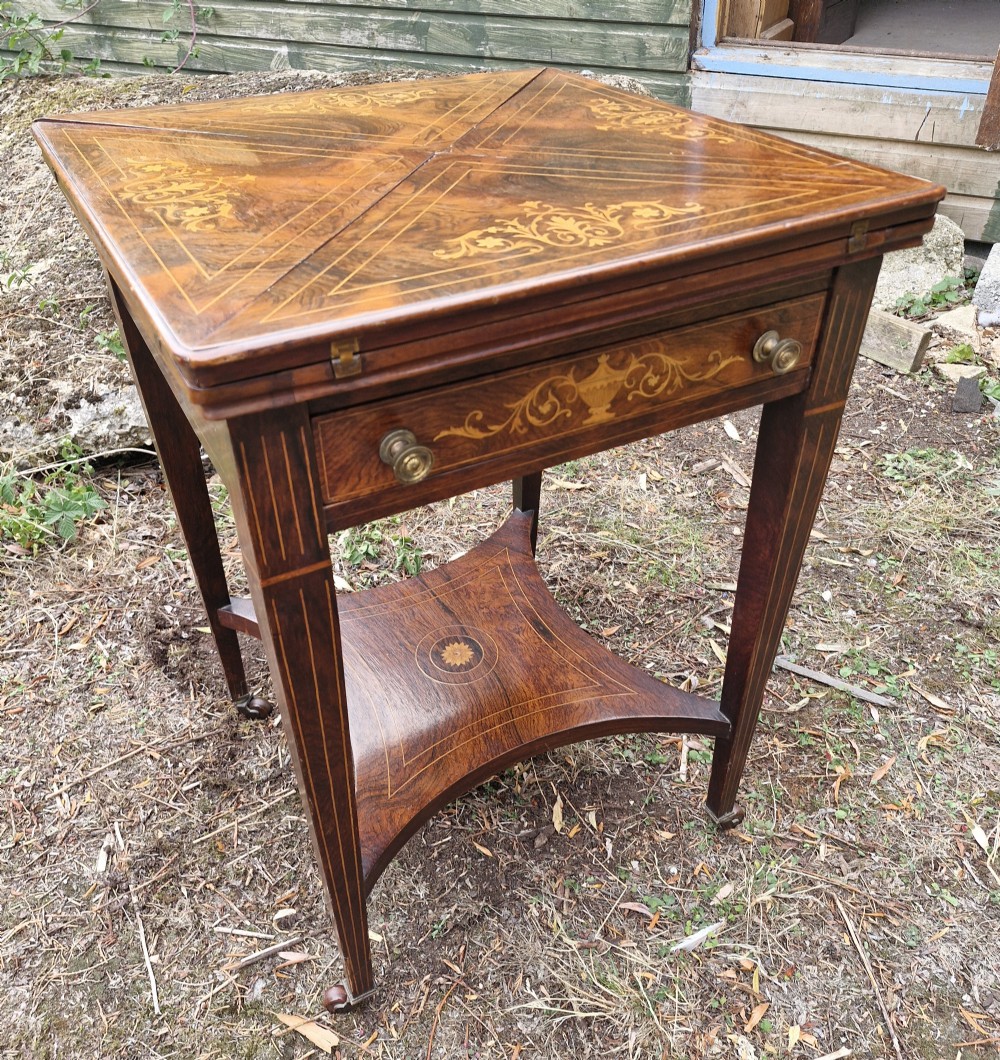 Edwardian inlaid rosewood envelope games table. 