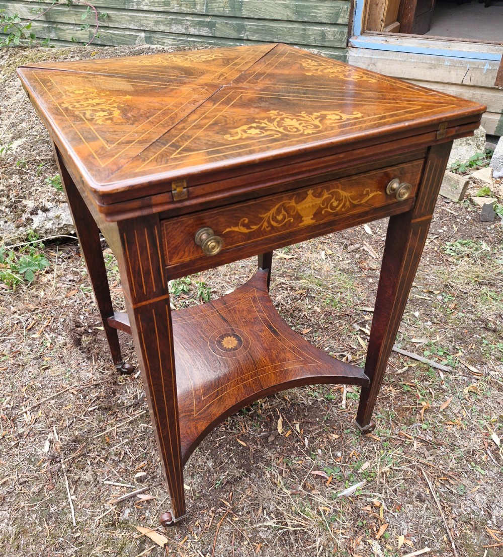 Edwardian inlaid rosewood envelope games table.  View IX