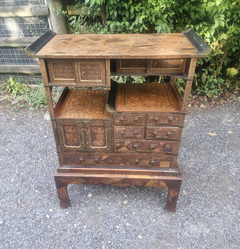 Japanese parquetry cabinet on stand. 