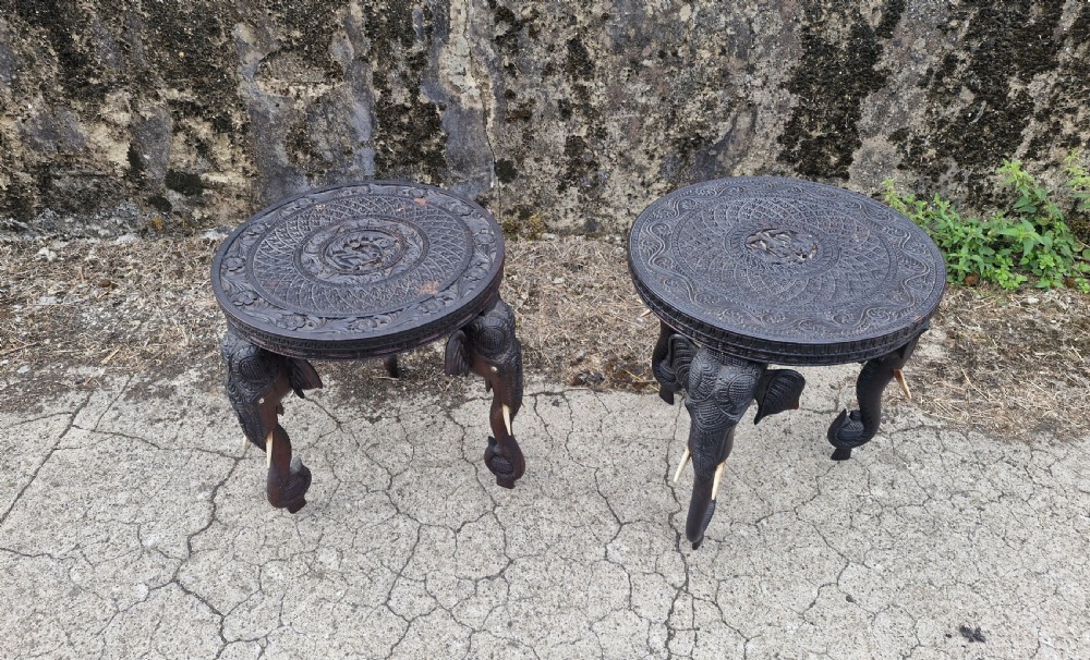 Matched pair of Indian elephant tables with bone tusks. 