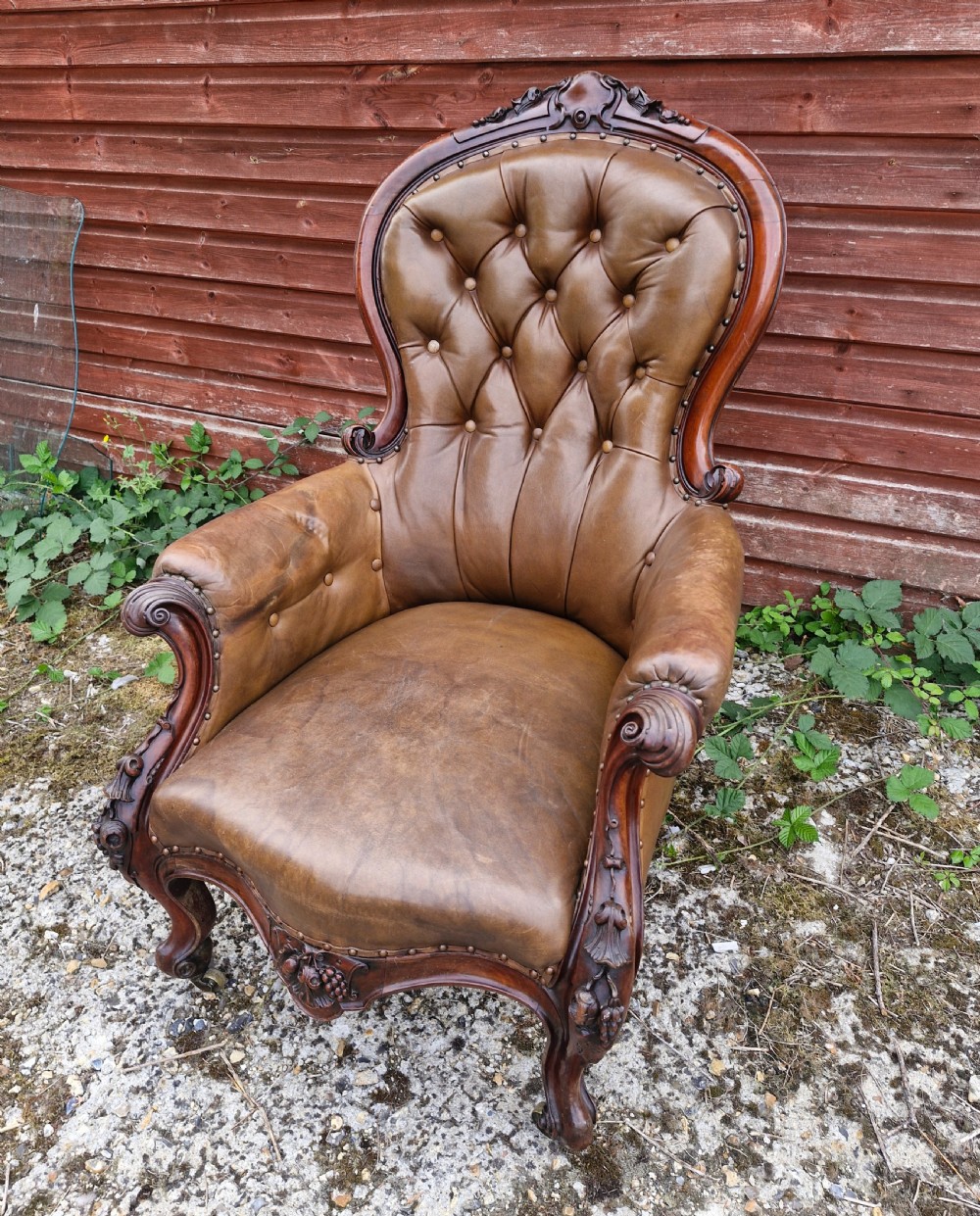 Large mahogany framed leather upholstered library armchair.  View IV