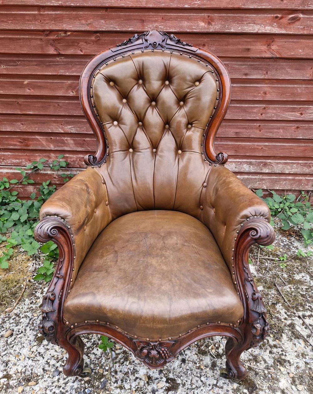 Large mahogany framed leather upholstered library armchair.  View V