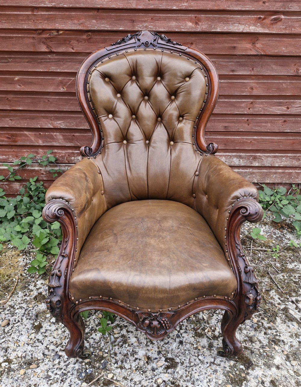 Large mahogany framed leather upholstered library armchair.  View VI