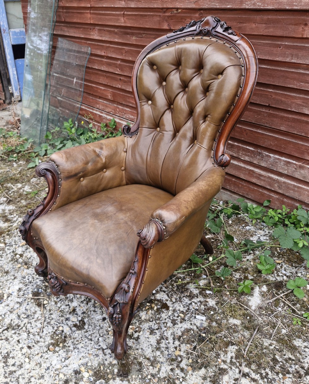 Large mahogany framed leather upholstered library armchair.  View VIII