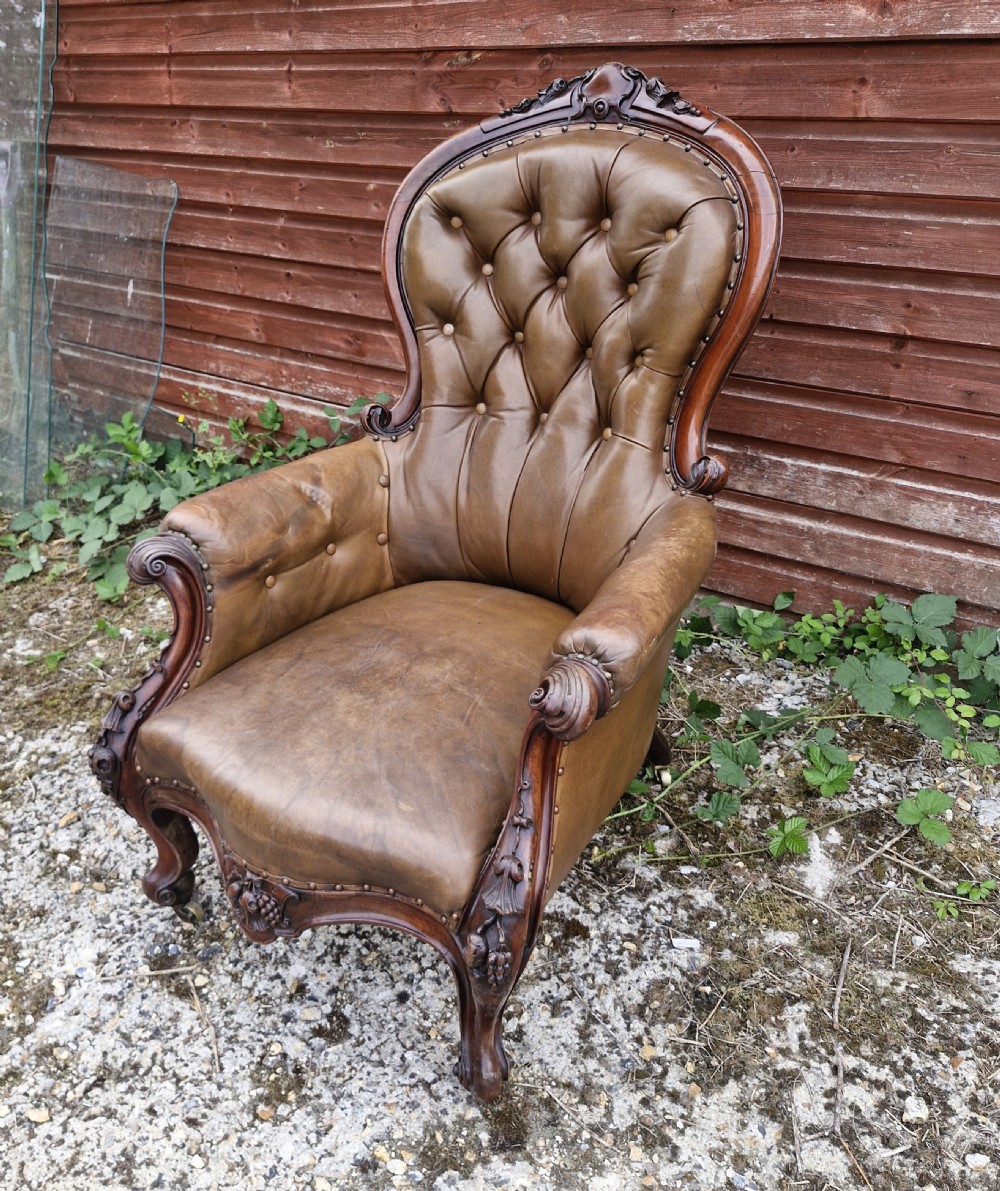 Large mahogany framed leather upholstered library armchair.  View IX