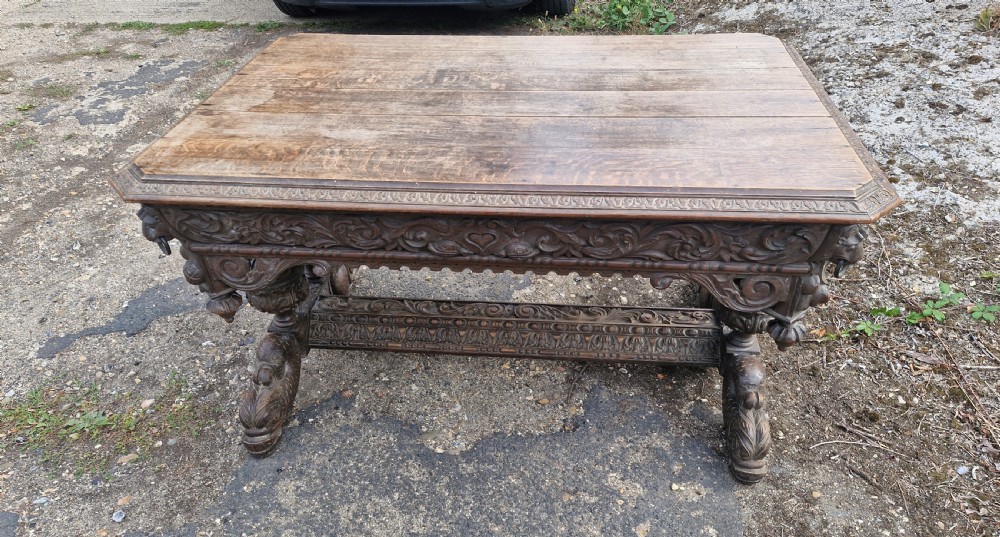 Large Victorian carved oak centre library table.  View IV