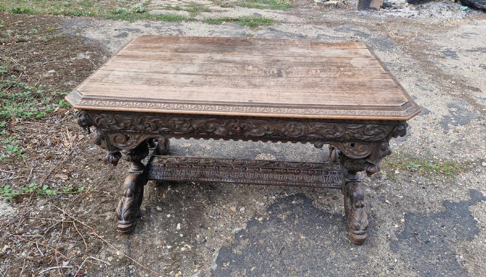 Large Victorian carved oak centre library table.  View IX
