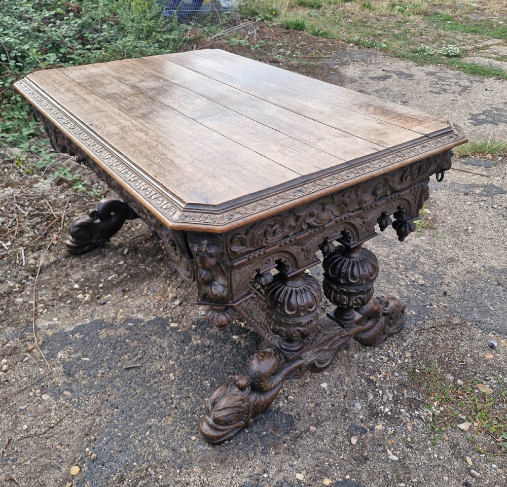 Large Victorian carved oak centre library table.  View XI