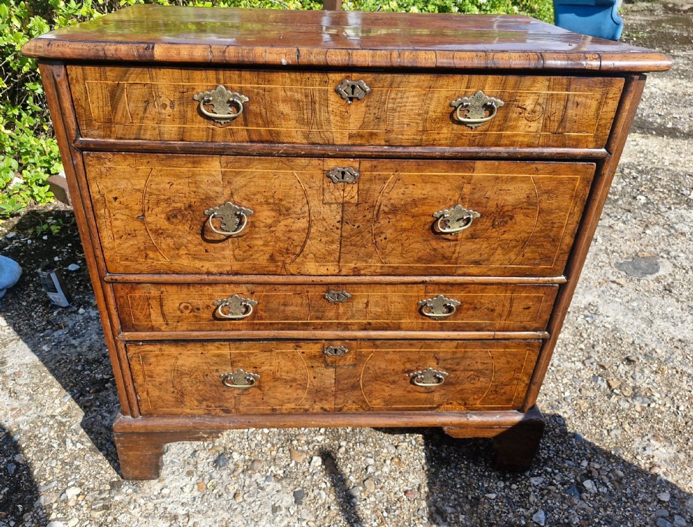 Early 18th century walnut chest of drawers.  View VII