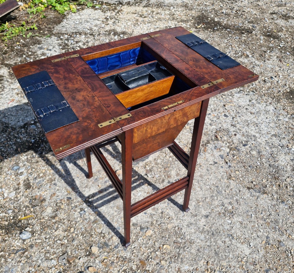 Edwardian walnut and mahogany sewing table. 