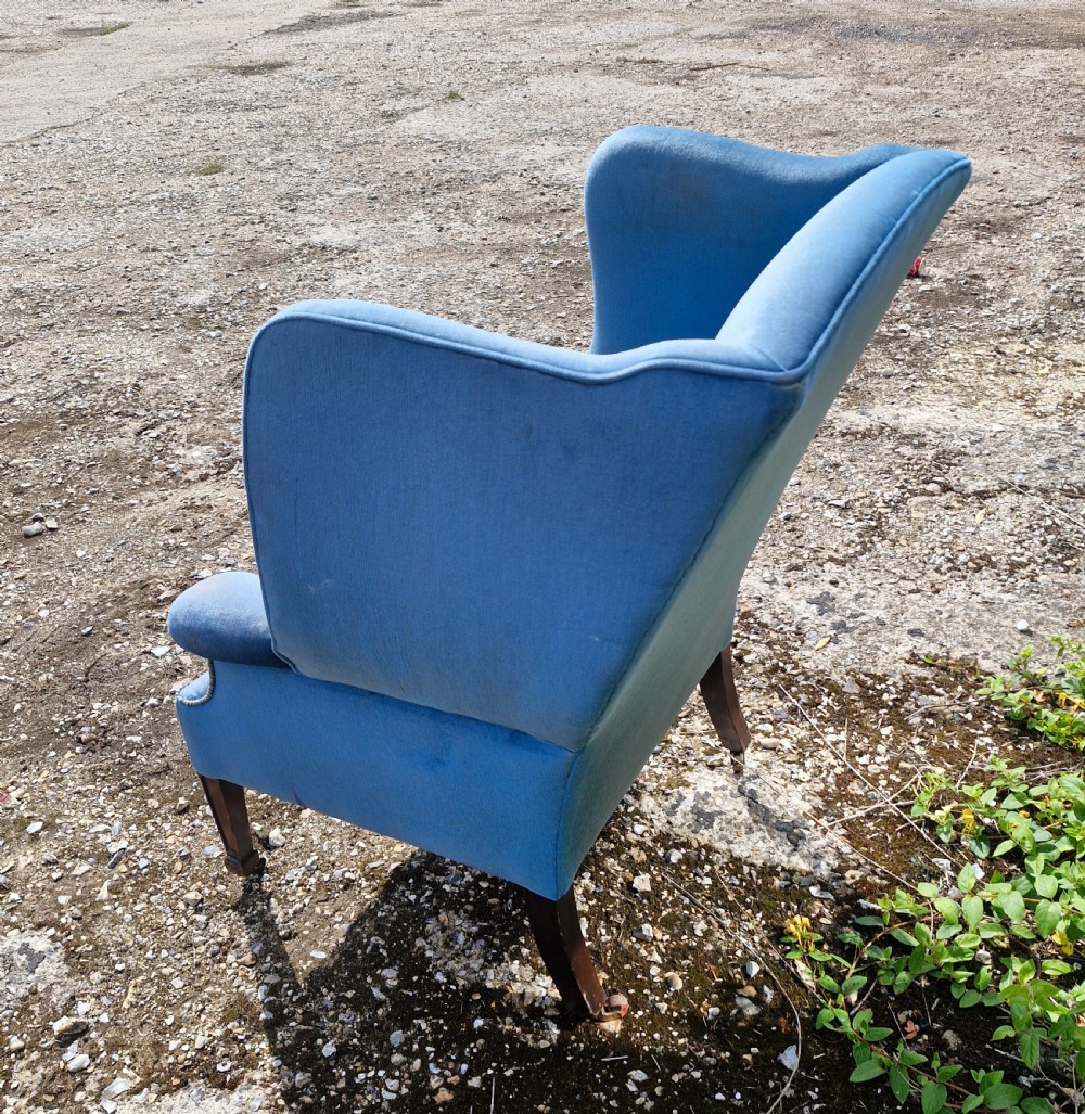 Good sized upholstered wing back armchair.  View V