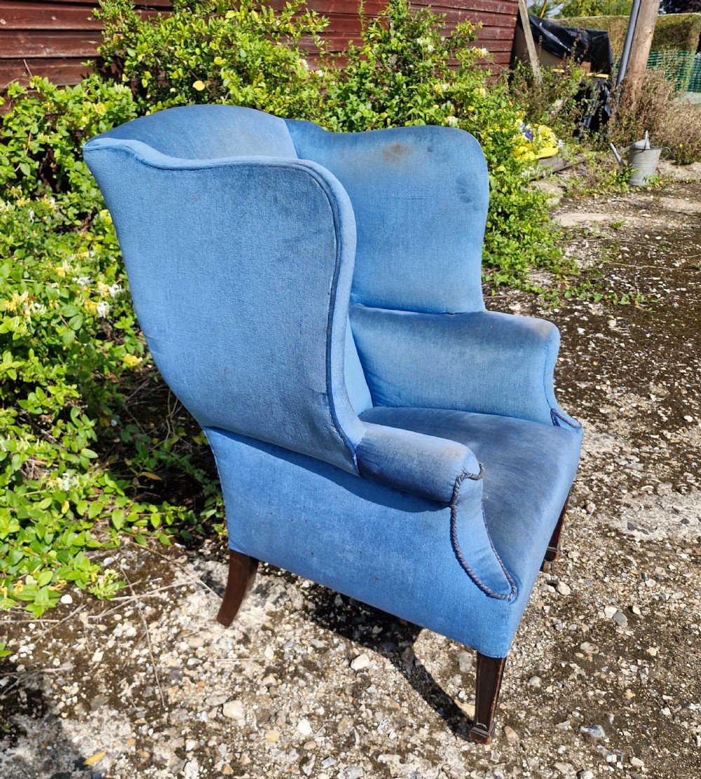Good sized upholstered wing back armchair.  View VI
