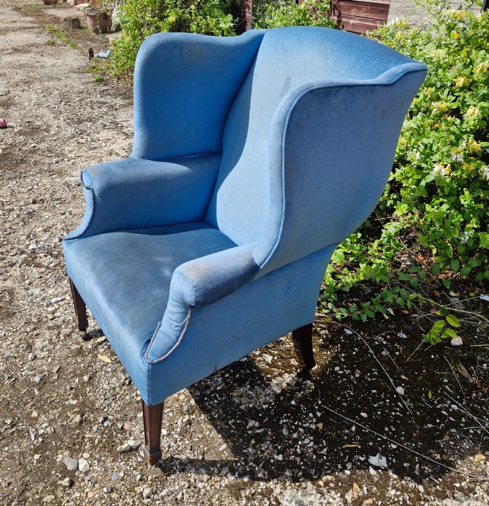 Good sized upholstered wing back armchair.  View VII