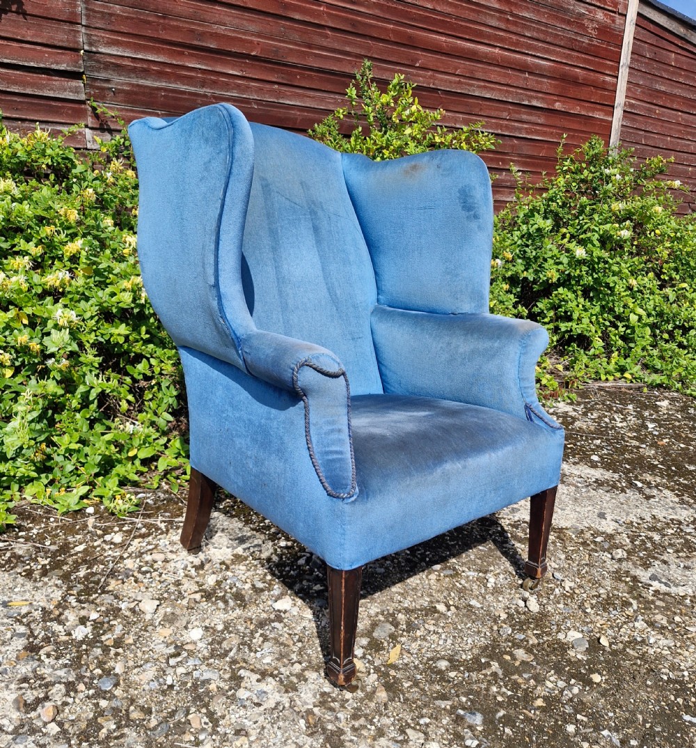 Good sized upholstered wing back armchair.  View VIII