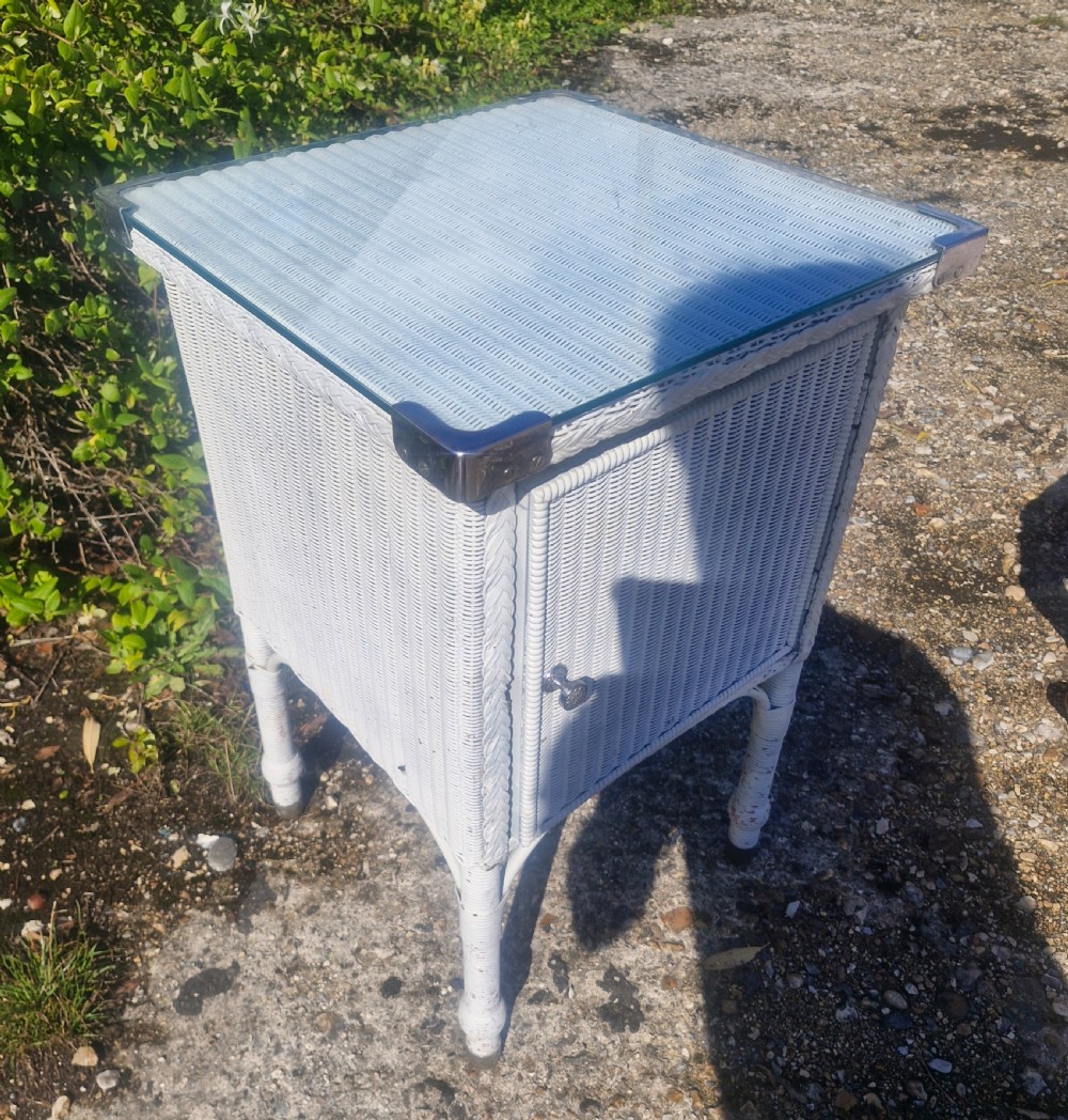 Large Lloyd Loom bathroom cabinet with plate glass top. View III