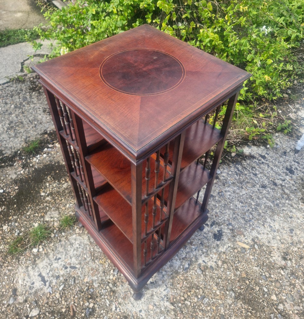 Edwardian inlaid mahogany revolving bookcase with makers stamp. View II