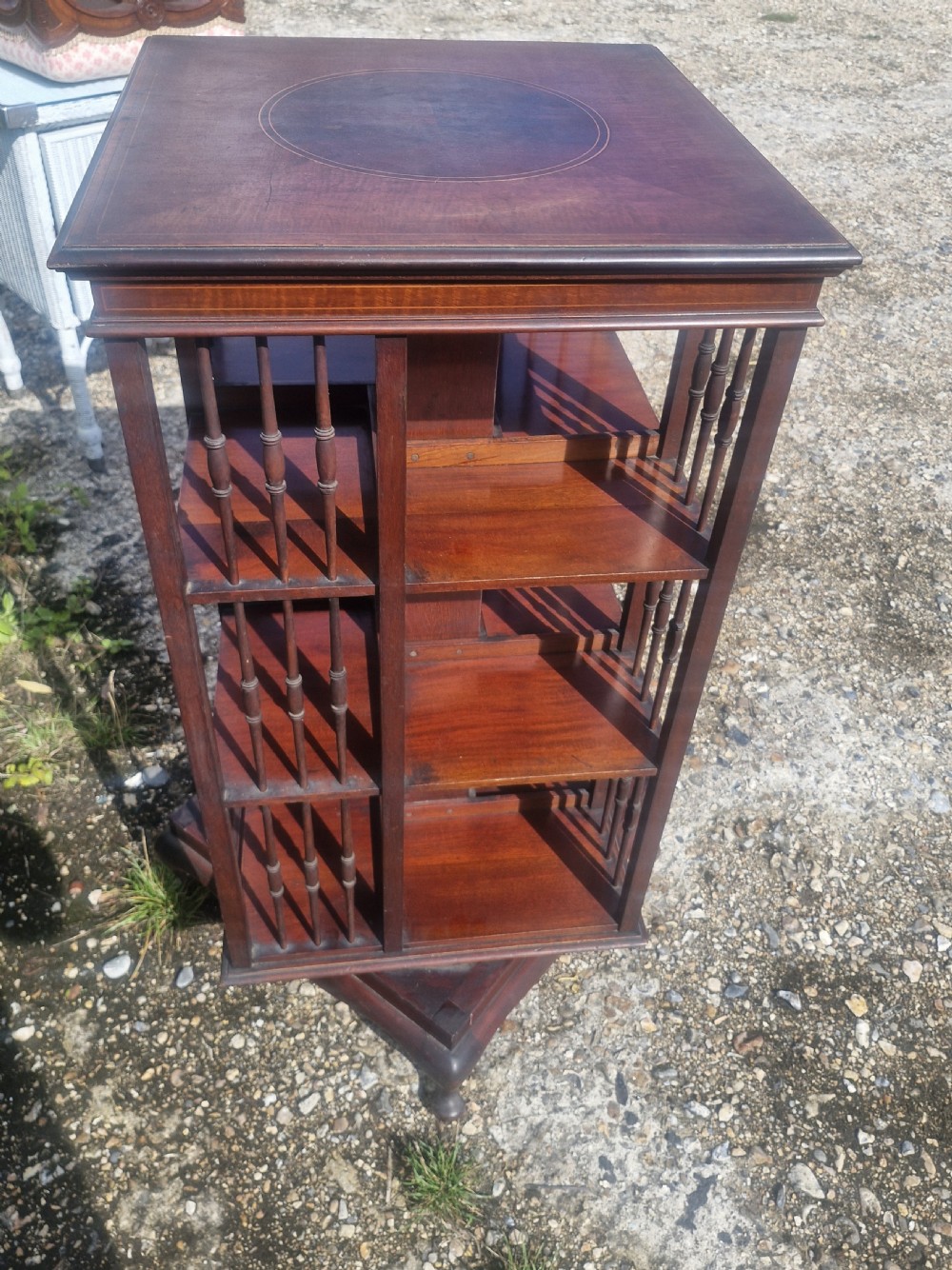 Edwardian inlaid mahogany revolving bookcase with makers stamp. View VI
