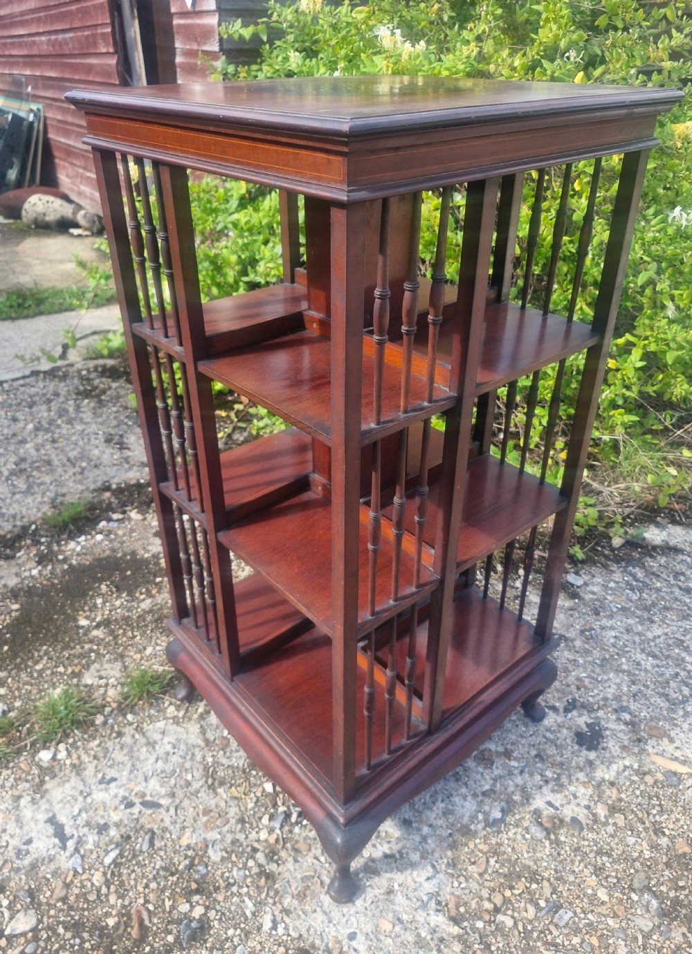 Edwardian inlaid mahogany revolving bookcase with makers stamp. View VII