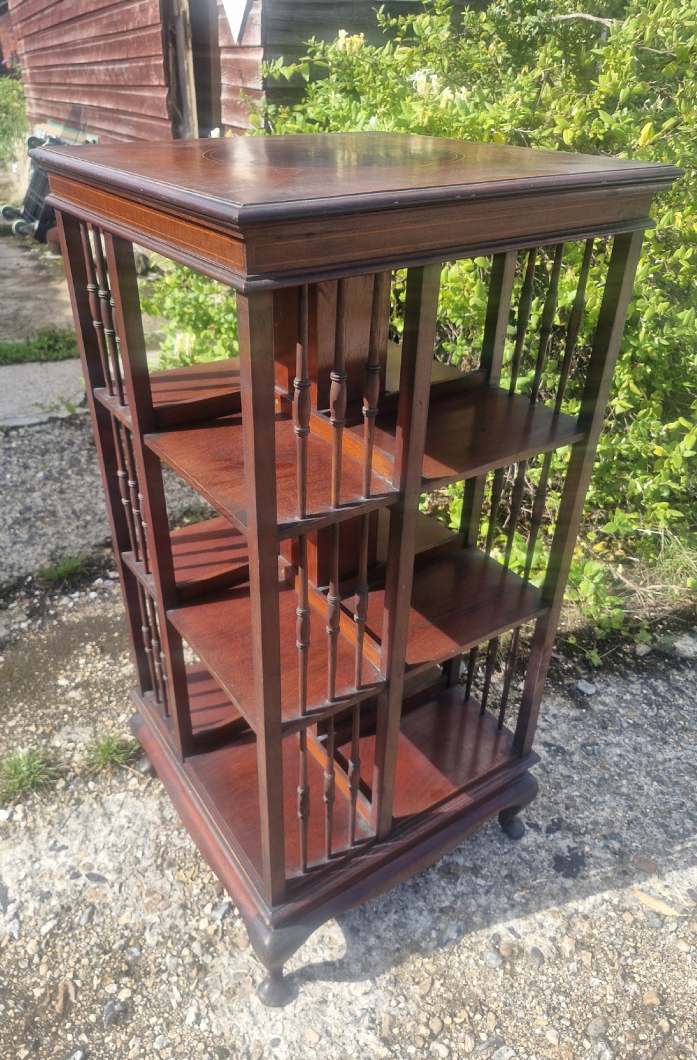 Edwardian inlaid mahogany revolving bookcase with makers stamp. View VIII