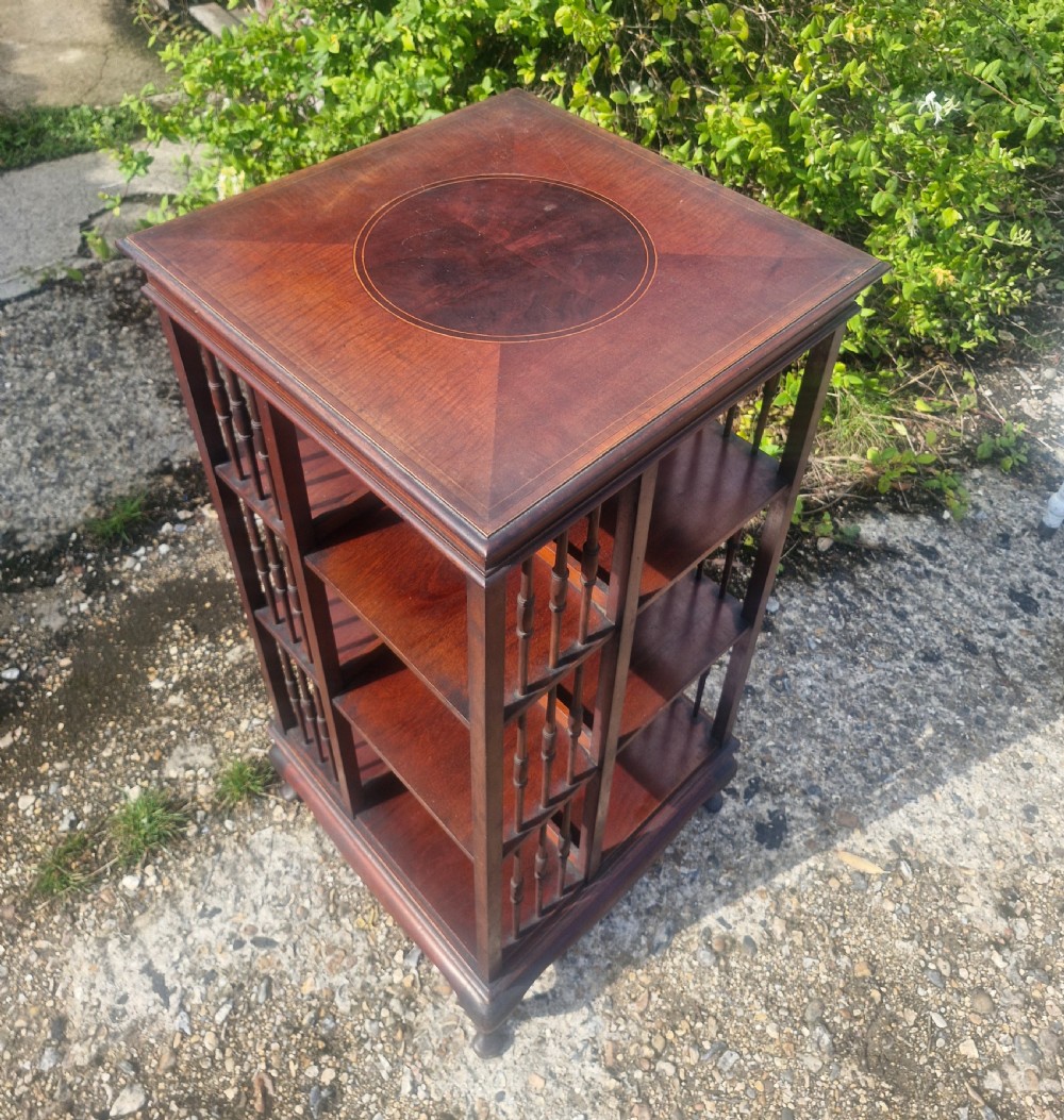 Edwardian inlaid mahogany revolving bookcase with makers stamp. View IX