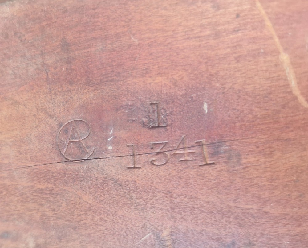 Edwardian inlaid mahogany revolving bookcase with makers stamp. View X