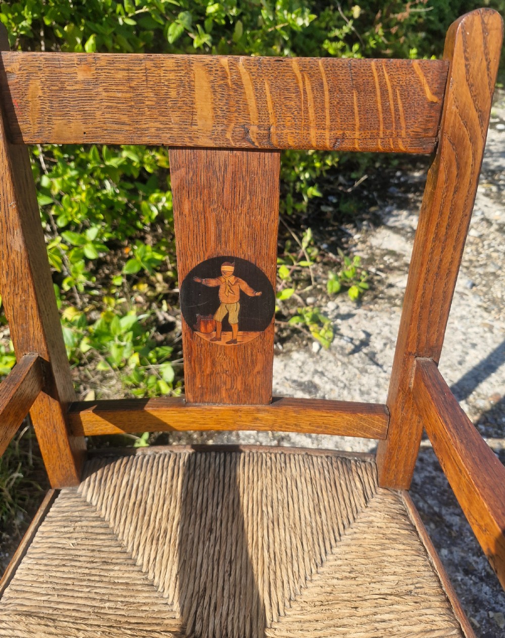 Oak inlaid Childs rocking chair in the manner of Liberty's.  View II