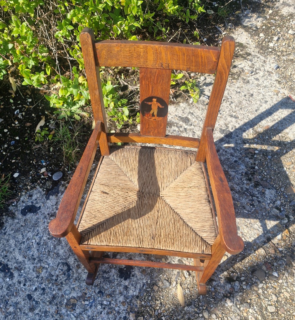 Oak inlaid Childs rocking chair in the manner of Liberty's.  View VI