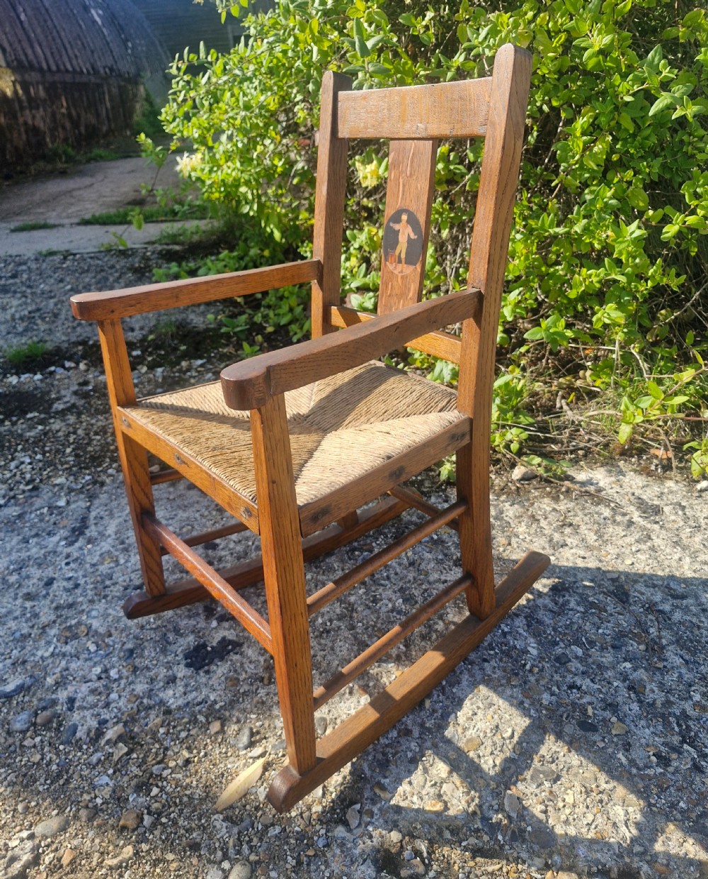 Oak inlaid Childs rocking chair in the manner of Liberty's.  View VII