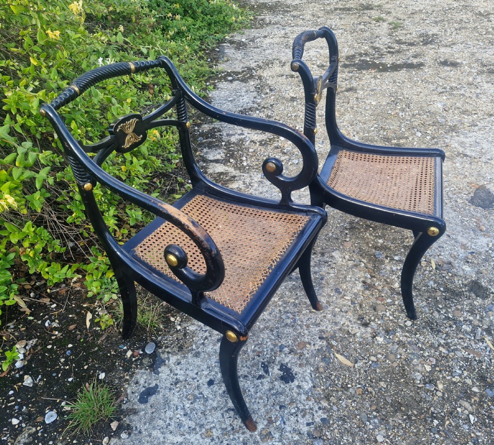 19th century ebonised gilt metal mounted sabre leg armchair plus matching single chair.  View V