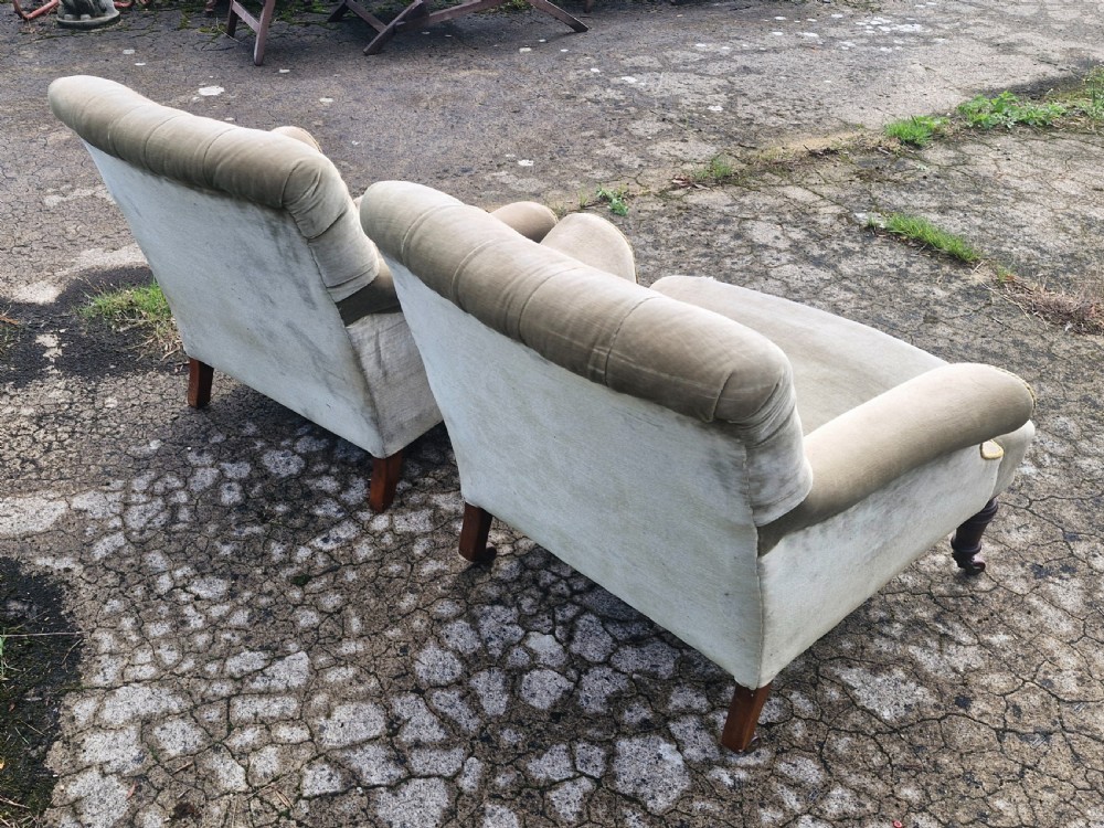 Matched pair of button back  upholstered armchairs.  View II