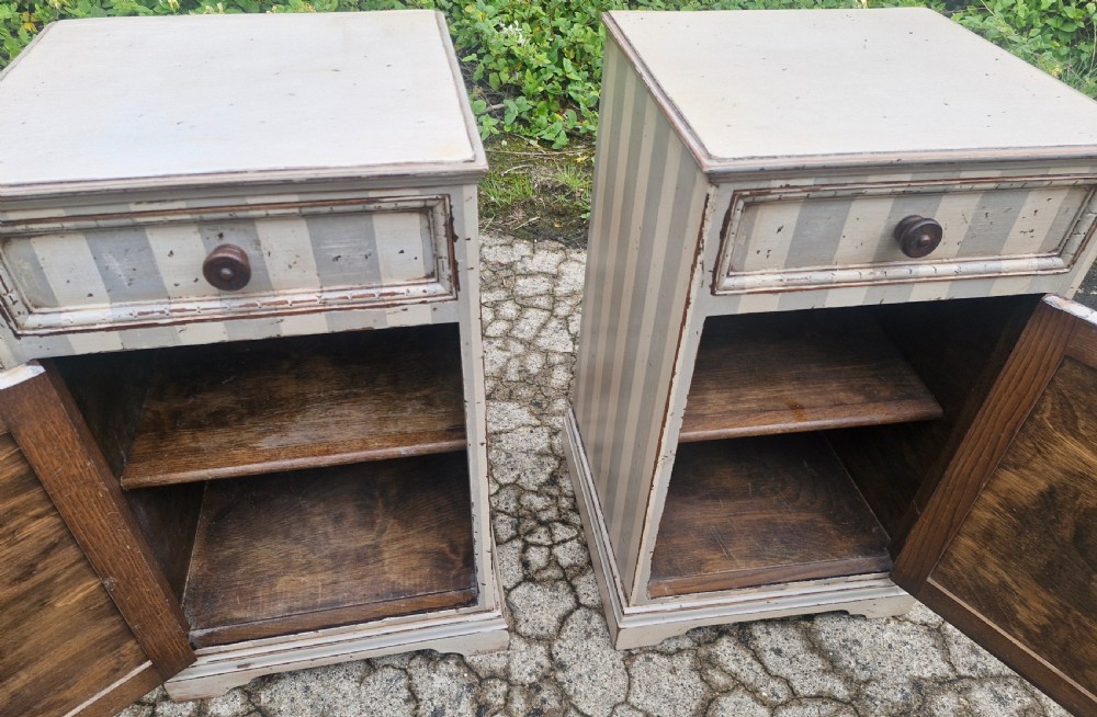 Pair of painted bedside cabinets.  View II
