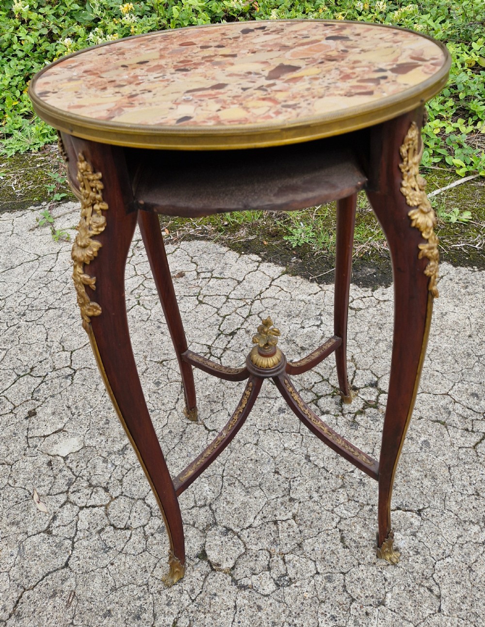Late 19th century gilt metal mounted marble top occasional table.  View IV